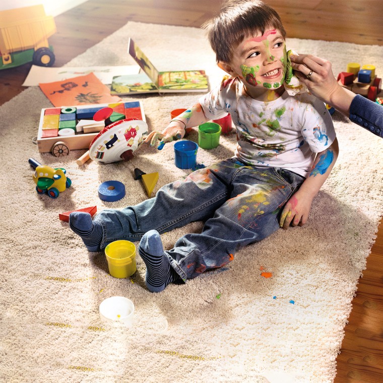 Child covered in paint Child covered in paint