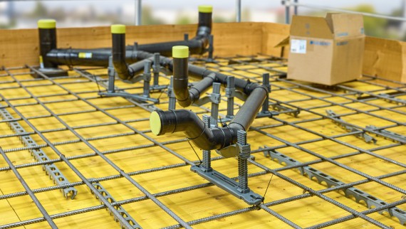 Geberit PE branch discharge pipe embedded in concrete