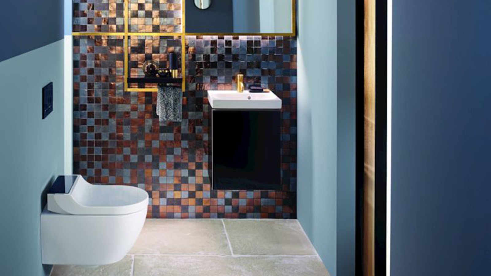 Gold and copper tones add warmth to this guest WC