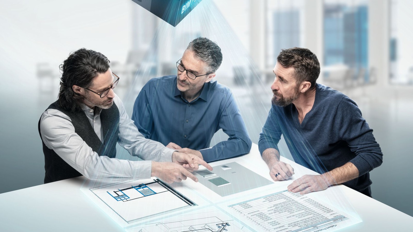 Planners deep in discussion around a table with BIM symbol Planners deep in discussion around a table with BIM symbol