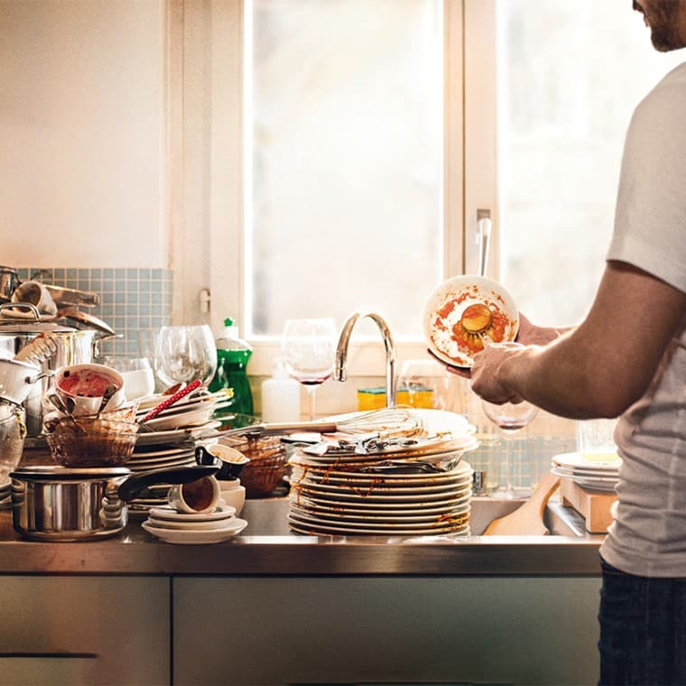 Dirty dishes stacked in the sink Dirty dishes stacked in the sink
