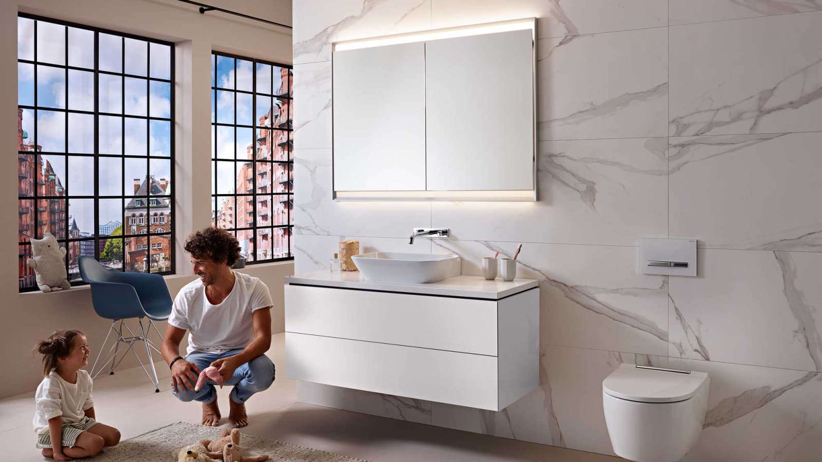 Man and child in a white bathroom from the Geberit ONE series Man and child in a white bathroom from the Geberit ONE series